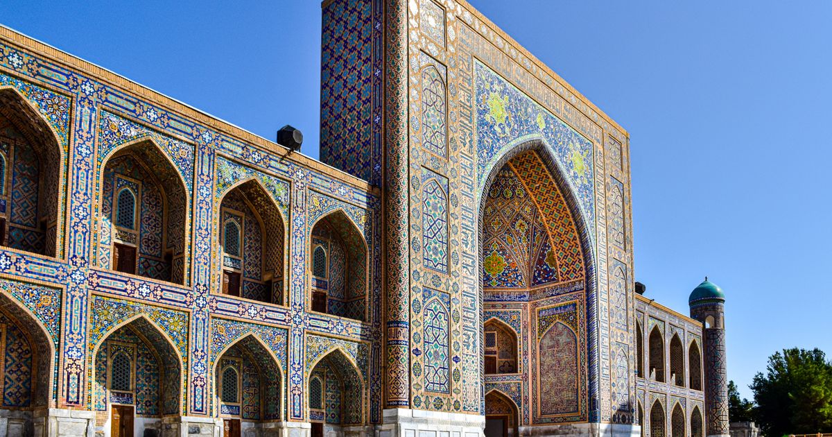 Tillya Kari Madrasah facade with blue and gold Islamic geometric patterns in Samarkand